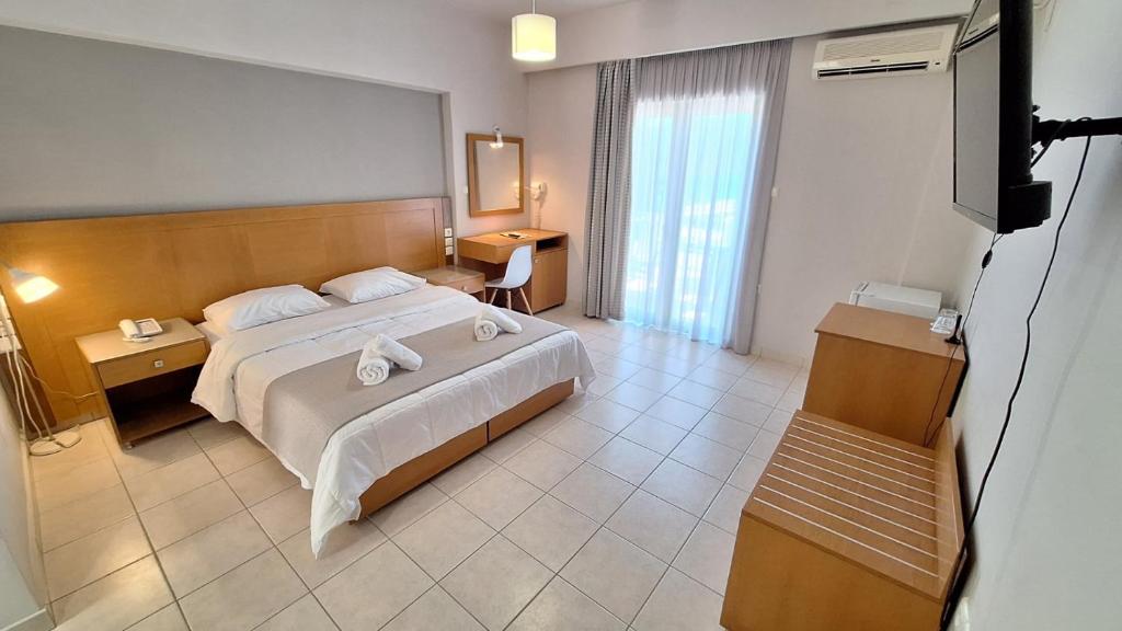 Posteľ alebo postele v izbe v ubytovaní Evita's Resort