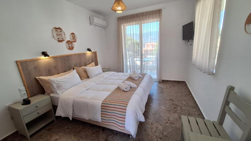 Posteľ alebo postele v izbe v ubytovaní Evita's Resort