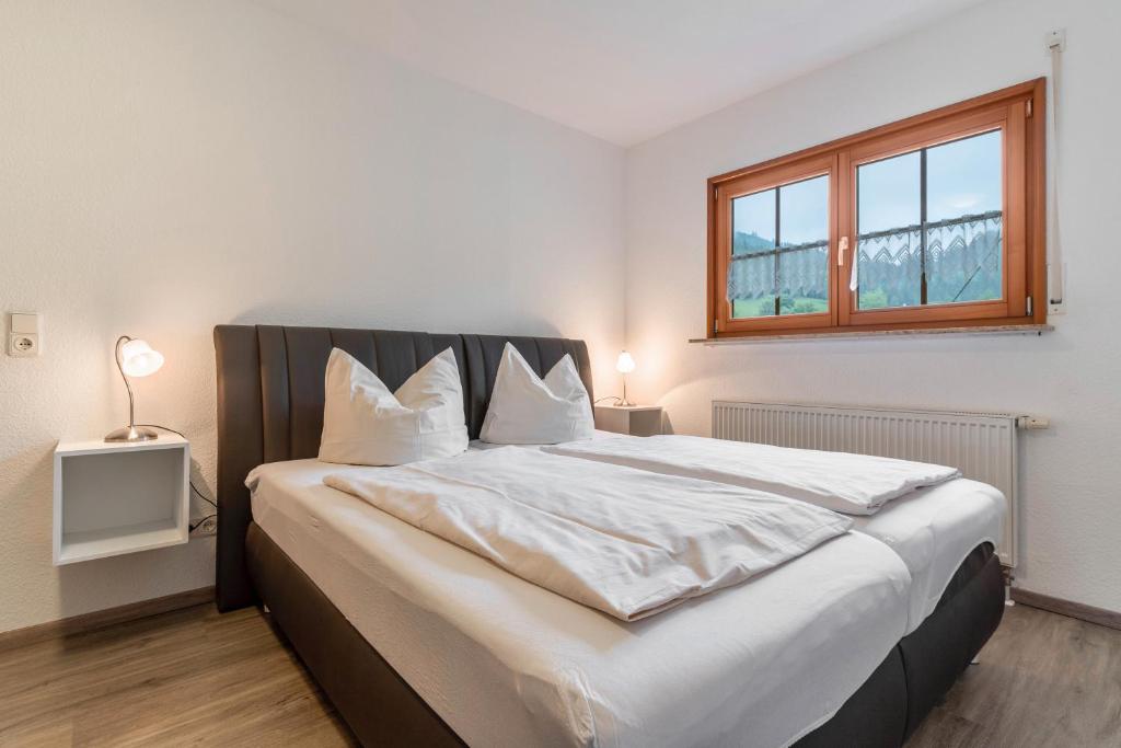 Postel nebo postele na pokoji v ubytování Haus Sum