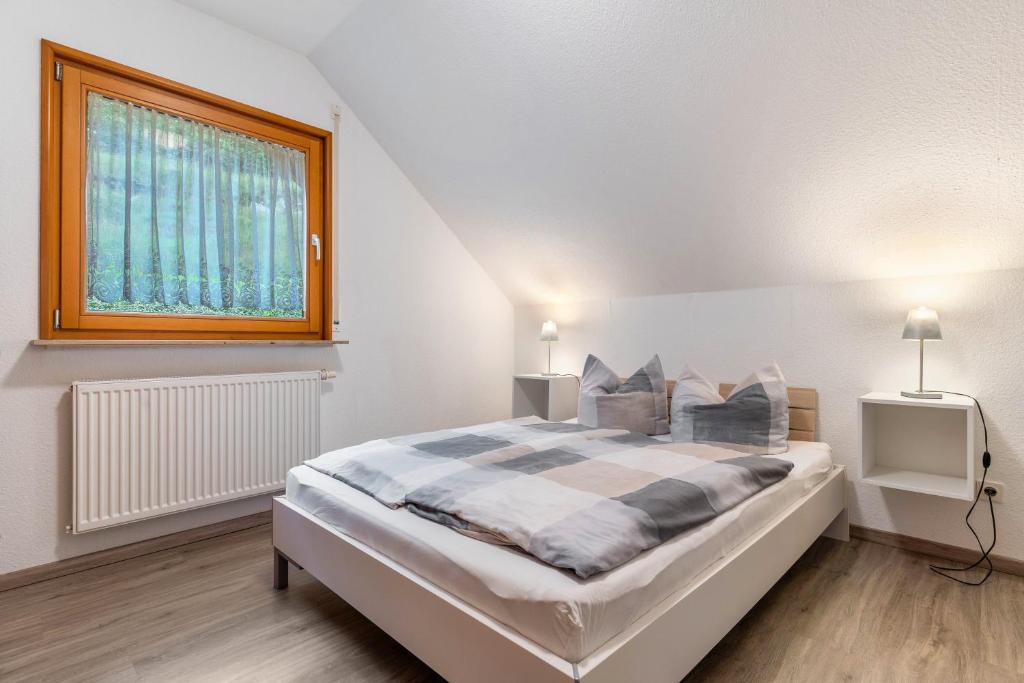 Postel nebo postele na pokoji v ubytování Haus Sum