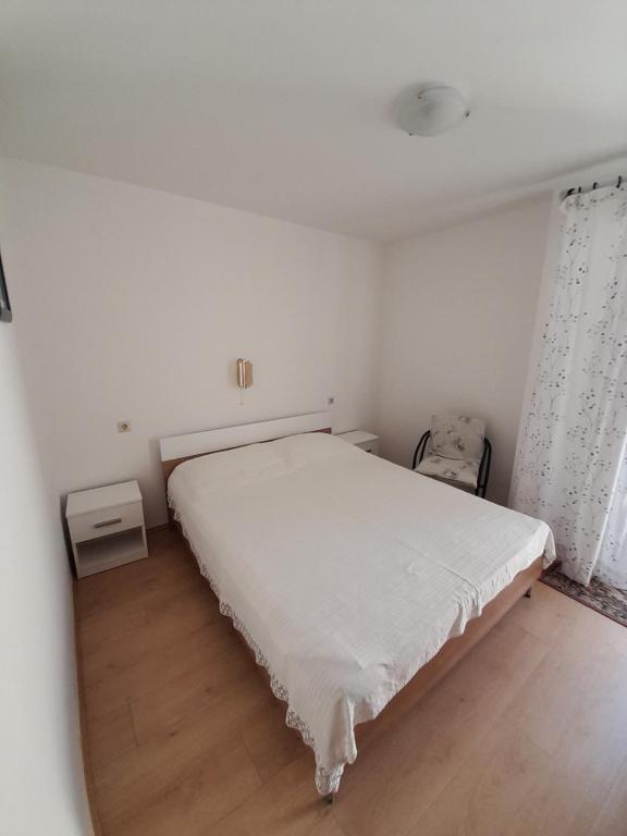 Postel nebo postele na pokoji v ubytování Apartments and Studios Vinko Matić