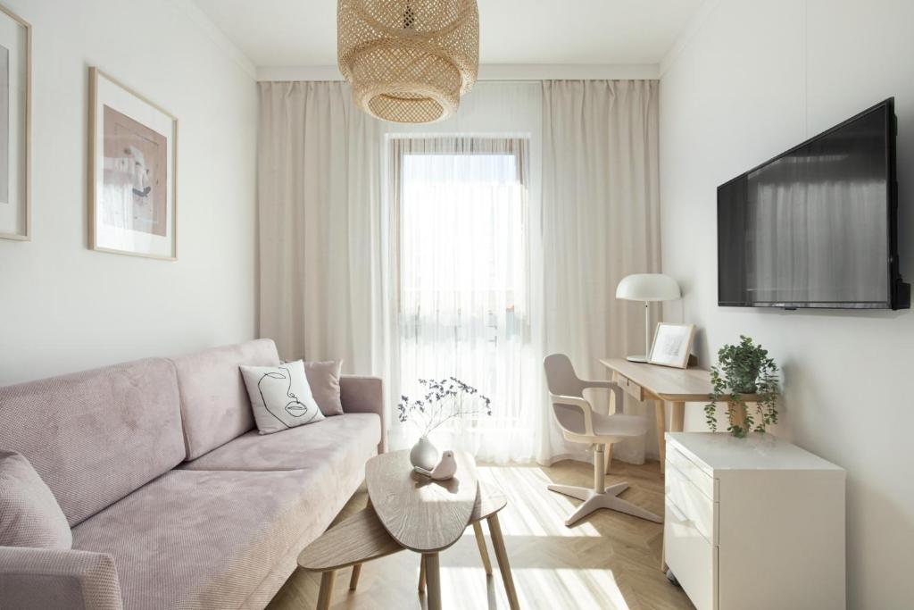 Televízia a/alebo spoločenská miestnosť v ubytovaní Elite Apartments Sunny