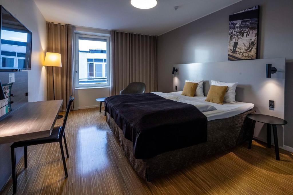 Postel nebo postele na pokoji v ubytování Scandic Aarhus City