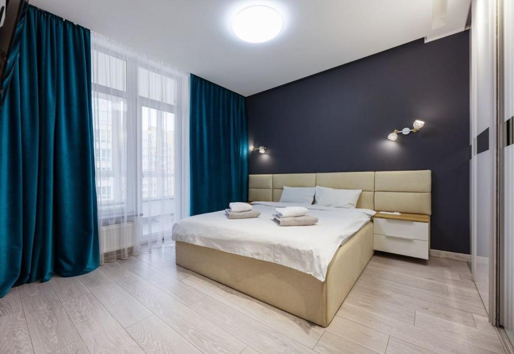 Postel nebo postele na pokoji v ubytování Nyvky Like Home - Nyvky Park Lux 149