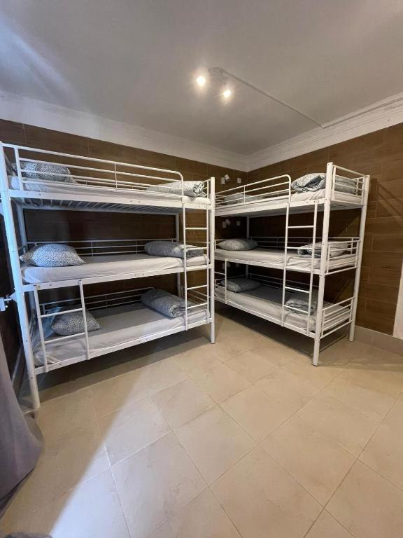 Postel nebo postele na pokoji v ubytování Samps Hostel