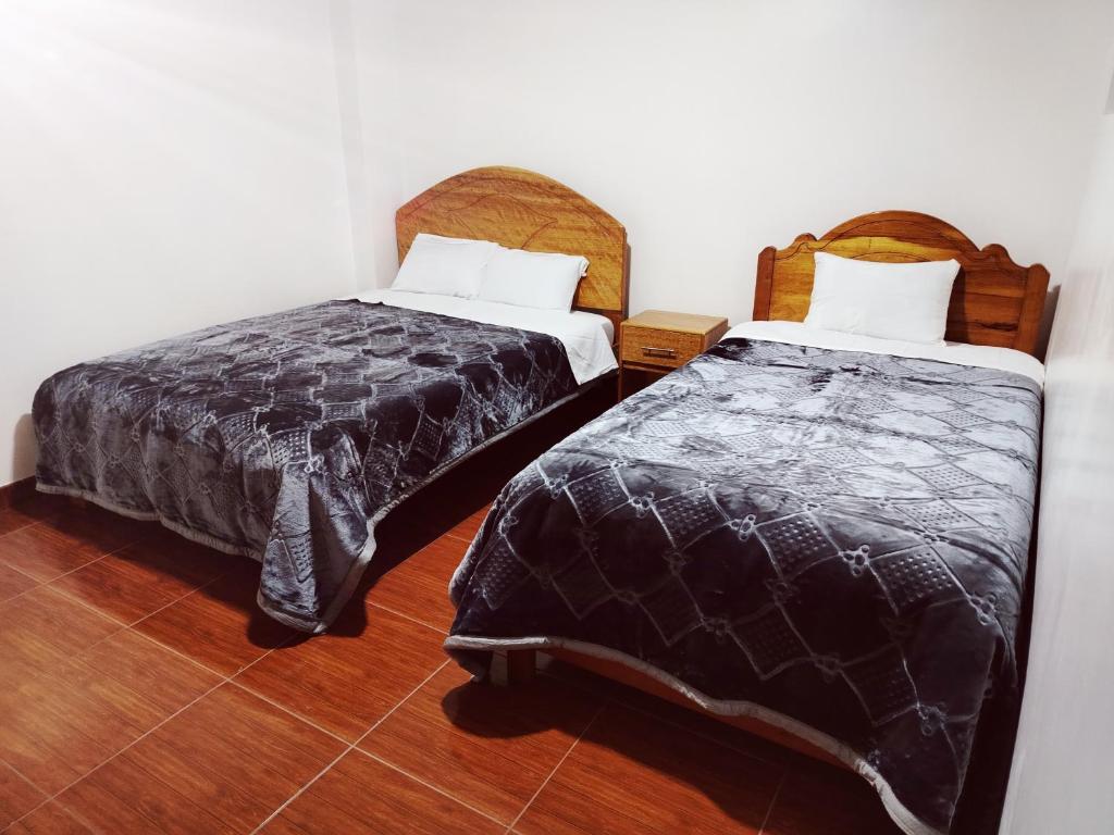 Postel nebo postele na pokoji v ubytování PATAWASI Guest House Cusco
