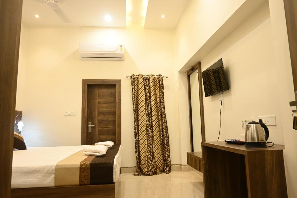 Postel nebo postele na pokoji v ubytování Manan Homestay