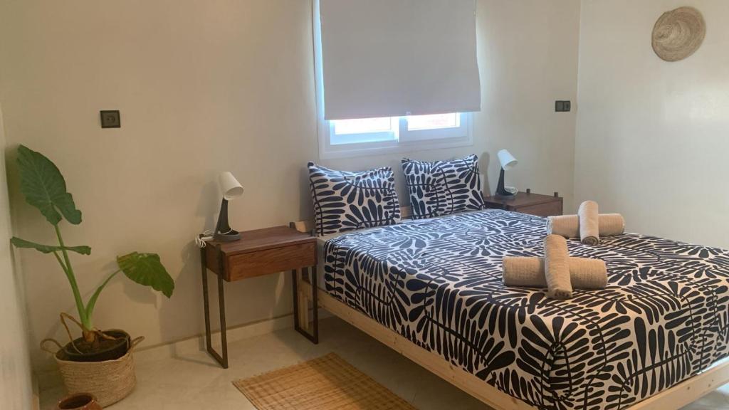 Postel nebo postele na pokoji v ubytování Al Mohit Hôtel Dakhla