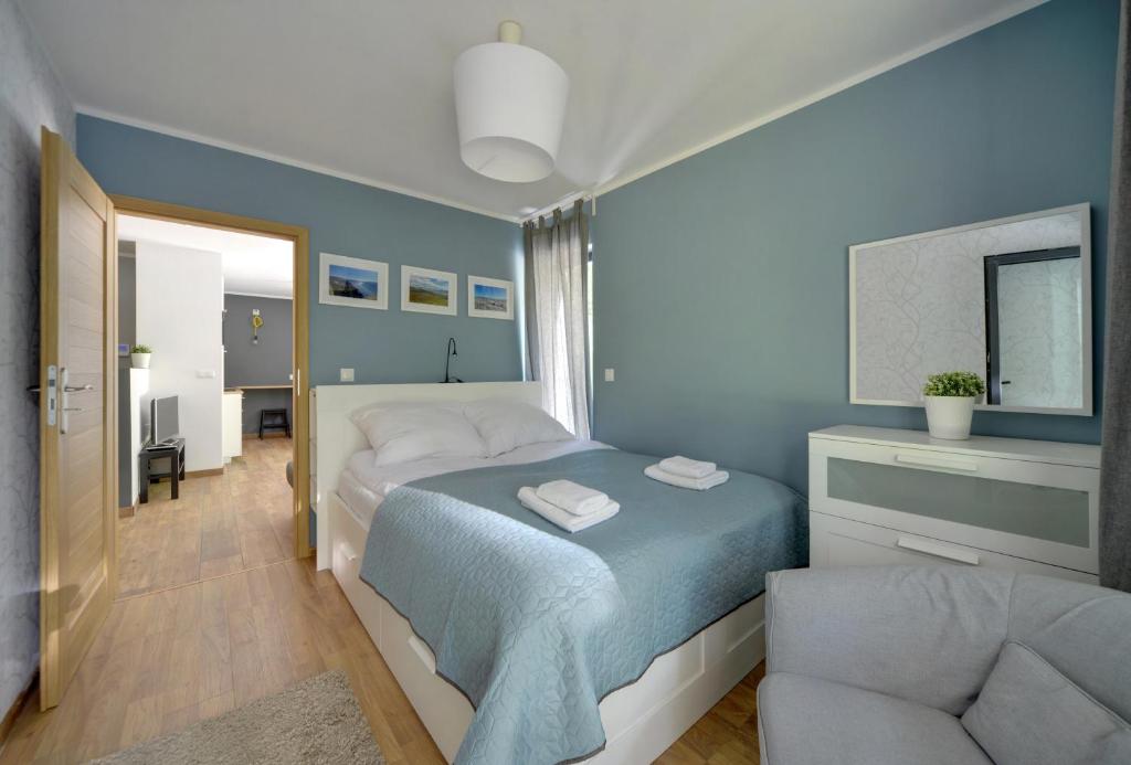 Postel nebo postele na pokoji v ubytování Ekskluzywne Apartamenty Sun Seasons 24 w Karpaczu by Noclegi Renters