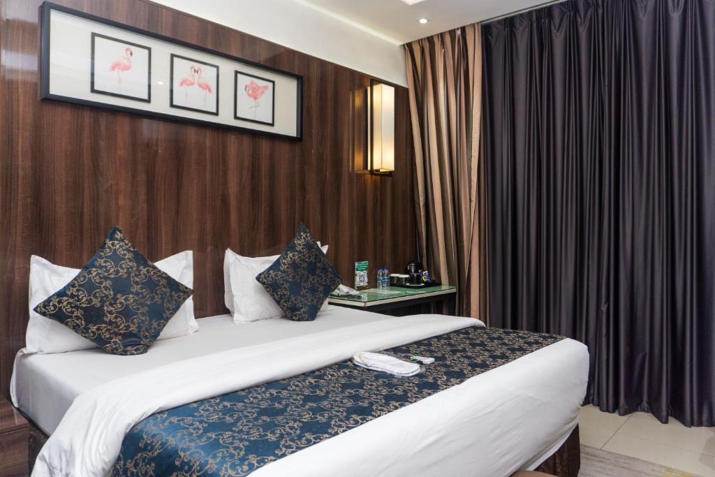 Postel nebo postele na pokoji v ubytování GreenPoint Hotel