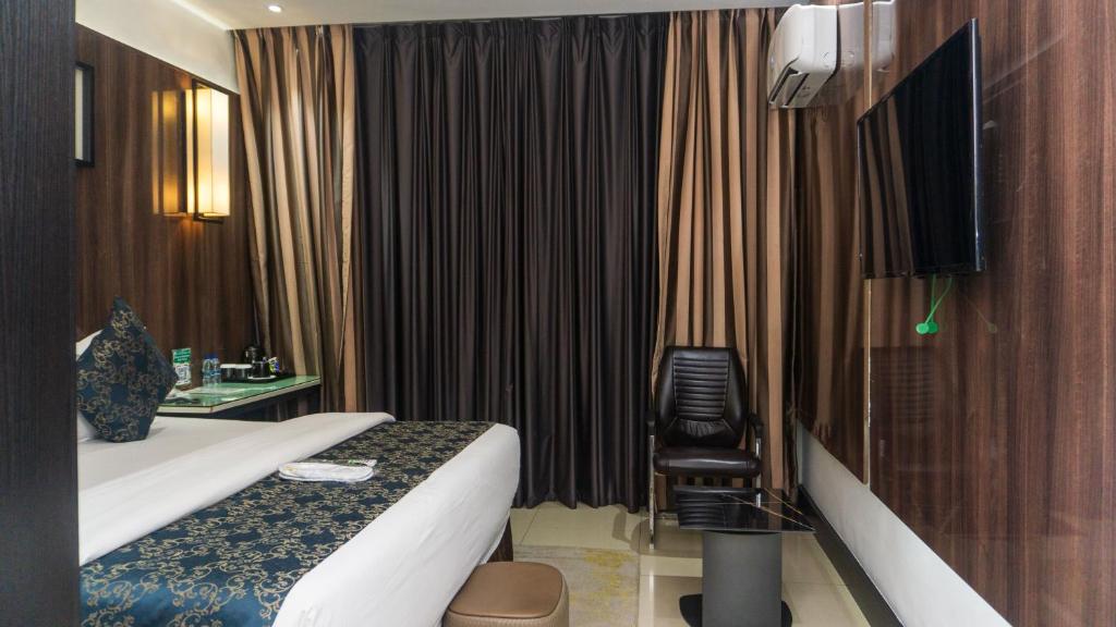 TV a/nebo společenská místnost v ubytování GreenPoint Hotel
