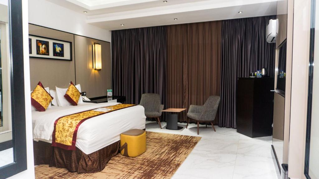 Postel nebo postele na pokoji v ubytování GreenPoint Hotel