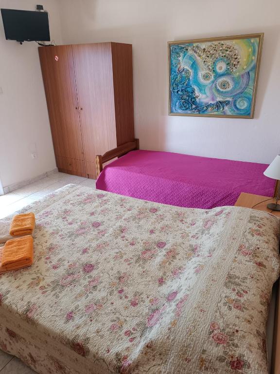 Postel nebo postele na pokoji v ubytování Anestis Apartments & rooms