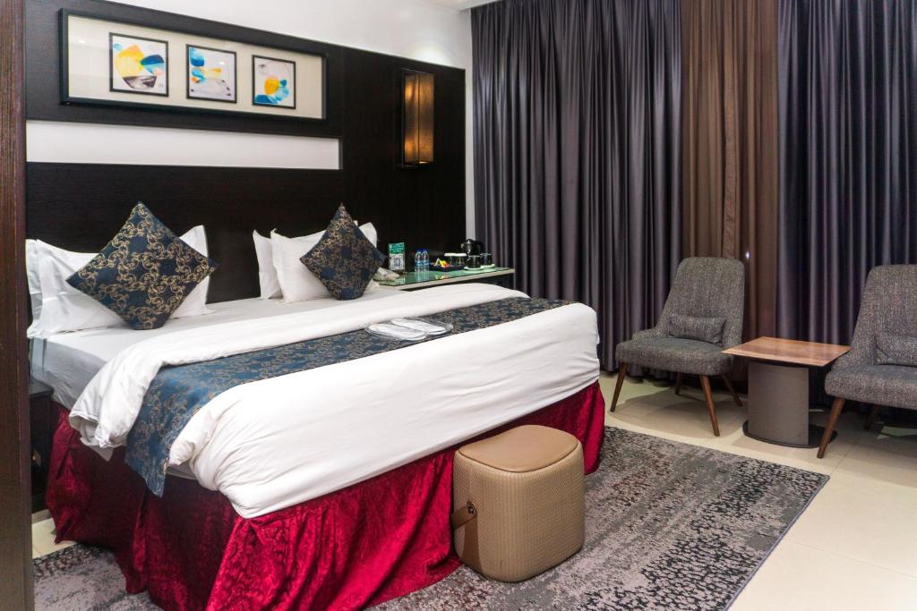 Postel nebo postele na pokoji v ubytování GreenPoint Hotel