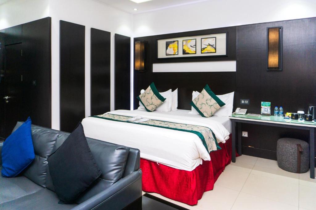 Postel nebo postele na pokoji v ubytování GreenPoint Hotel