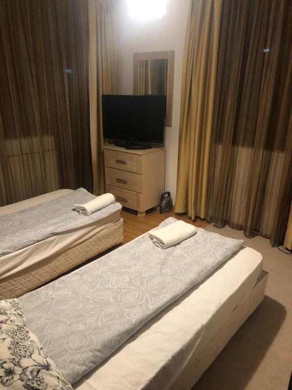 Postel nebo postele na pokoji v ubytování Bayrakova Guest House