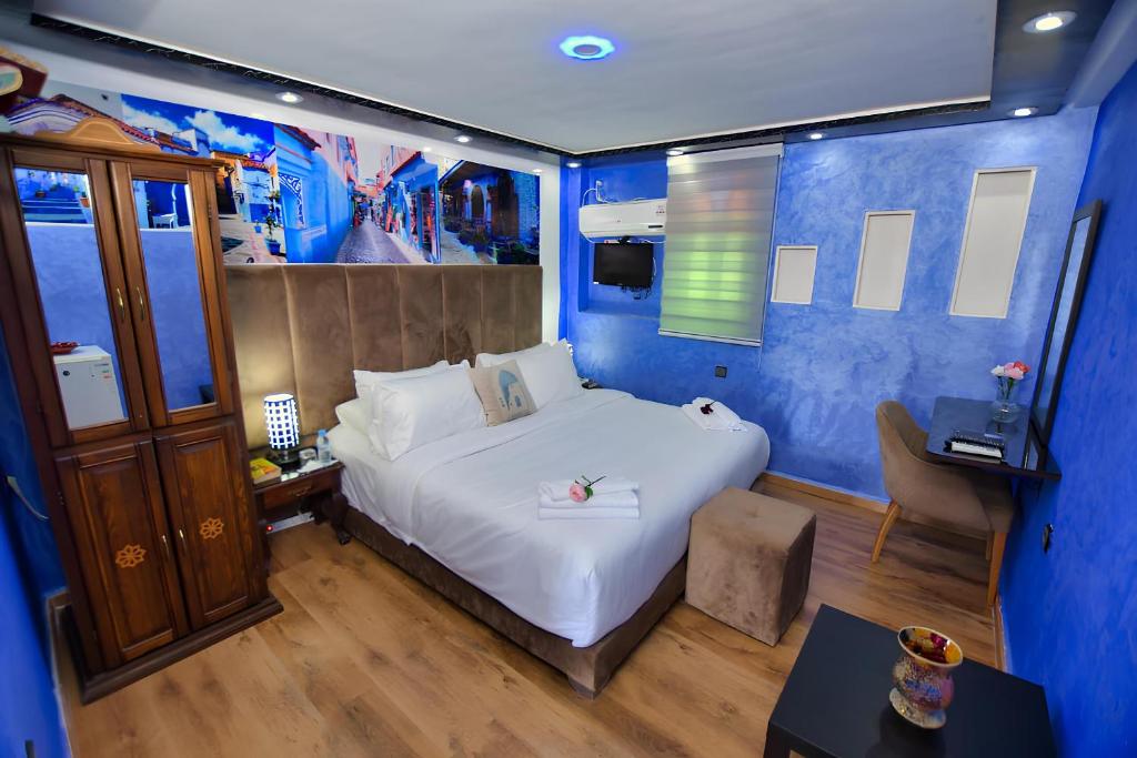 Postel nebo postele na pokoji v ubytování Hotel Dar Annasr