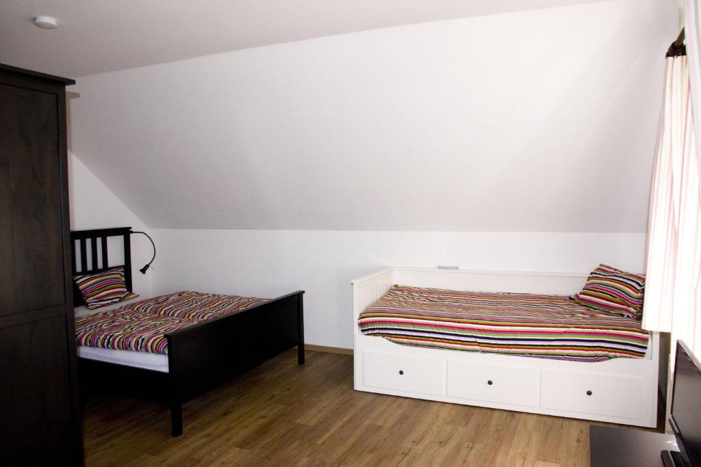 Postel nebo postele na pokoji v ubytování Penzion Albeř