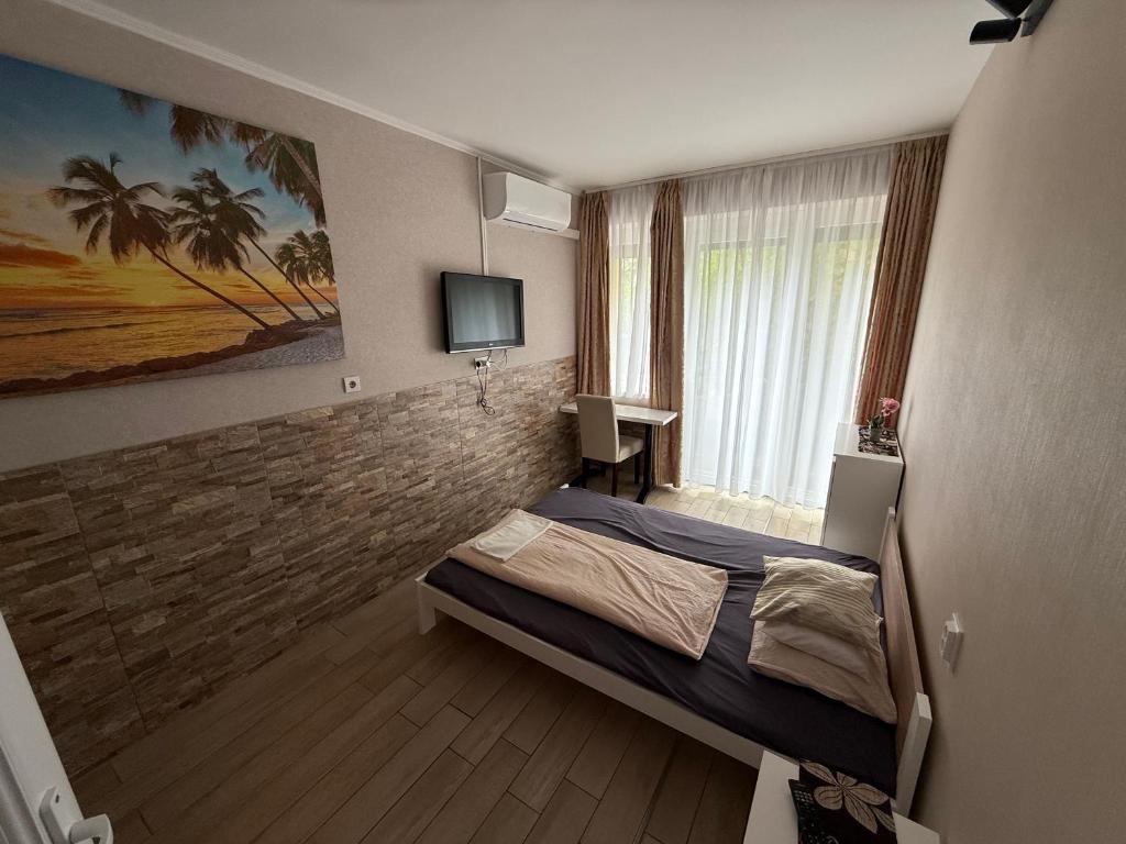 Postel nebo postele na pokoji v ubytování Mosoly Szallashely