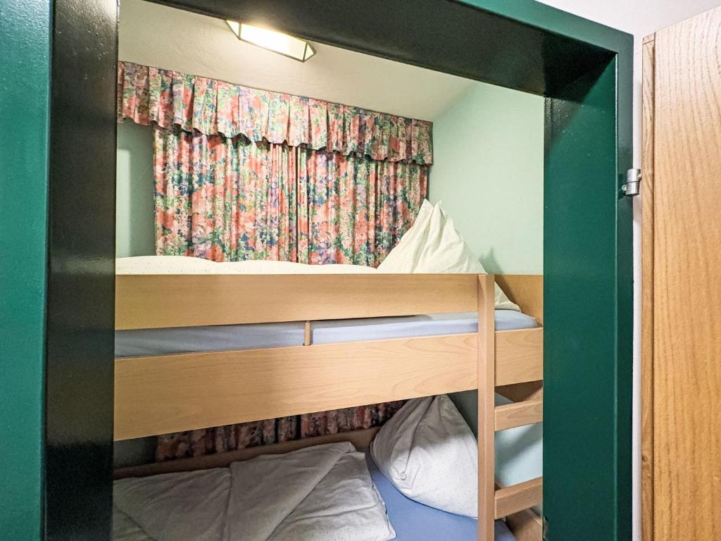 Łóżko lub łóżka w pokoju w obiekcie Apartment Dachstein-3 by Interhome