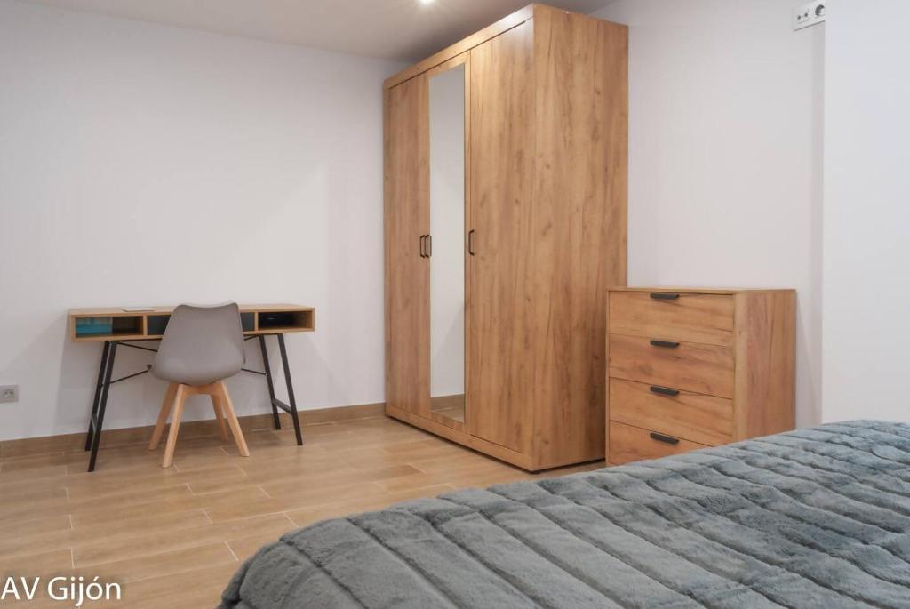 Postel nebo postele na pokoji v ubytování AV Gijón Alfonso I