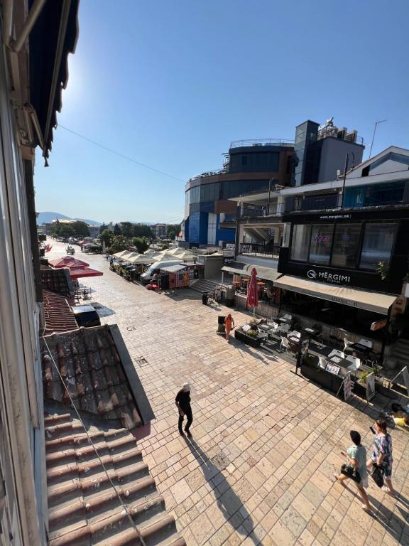 a group of people walking around an outdoor market at PARIS Luxury Center Apartment STRUGA in Struga