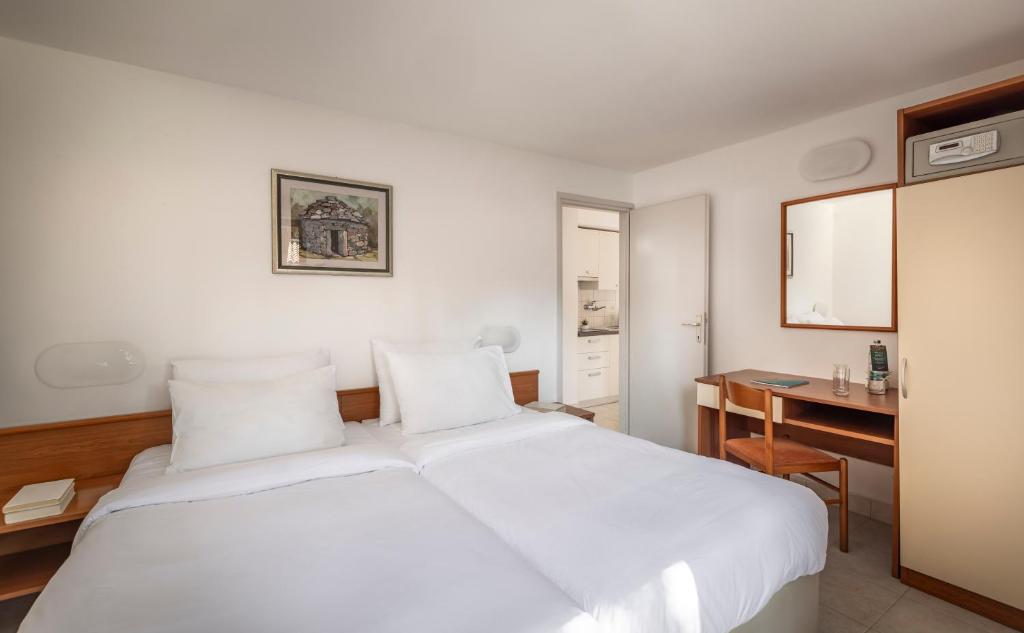 Кровать или кровати в номере Maistra Select Villas Rubin Resort