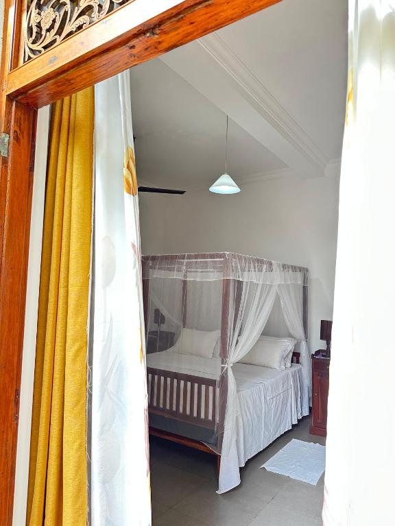 Postel nebo postele na pokoji v ubytování Swarnapaya résidence