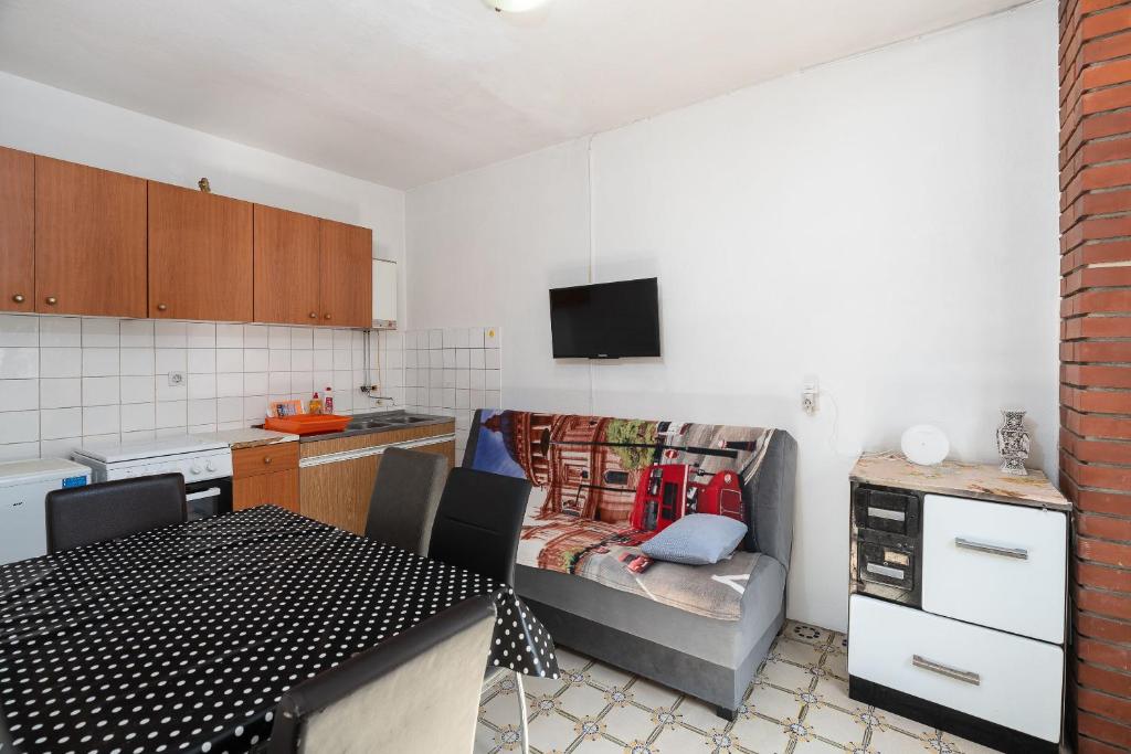 Kuchyň nebo kuchyňský kout v ubytování Apartment Sunny
