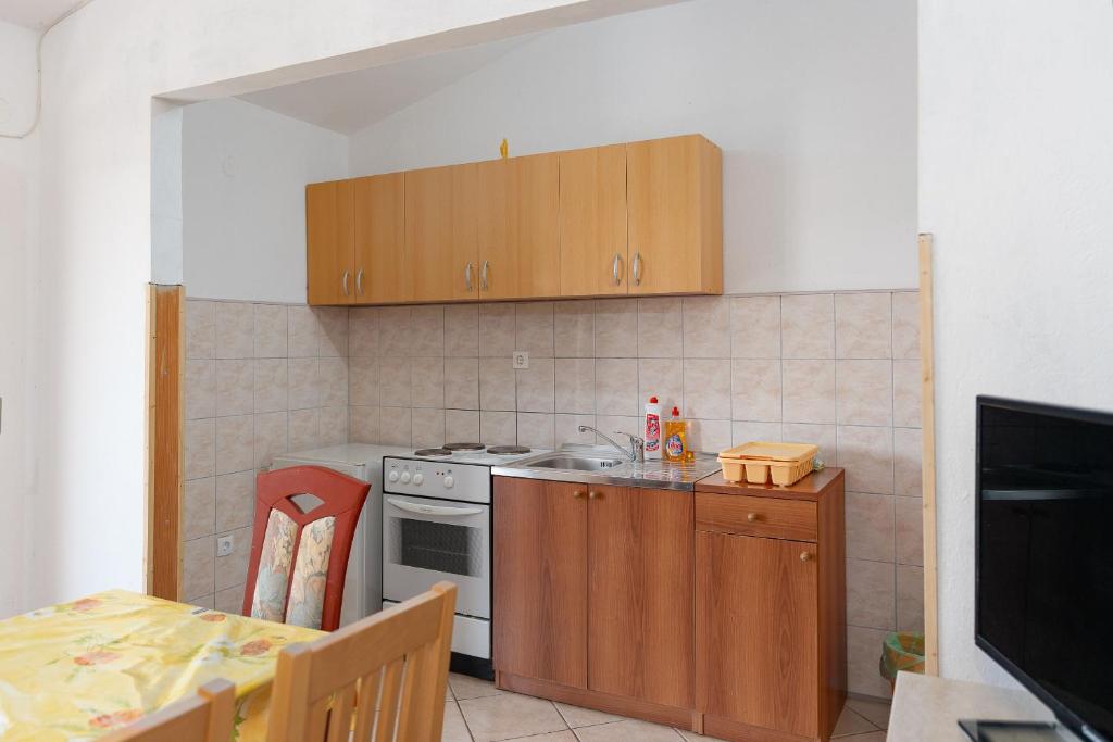 Kuchyň nebo kuchyňský kout v ubytování Apartment Sunny