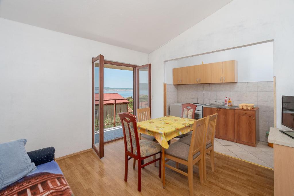 Kuchyň nebo kuchyňský kout v ubytování Apartment Sunny
