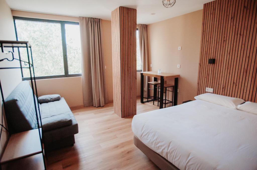 Ένα ή περισσότερα κρεβάτια σε δωμάτιο στο Polotel