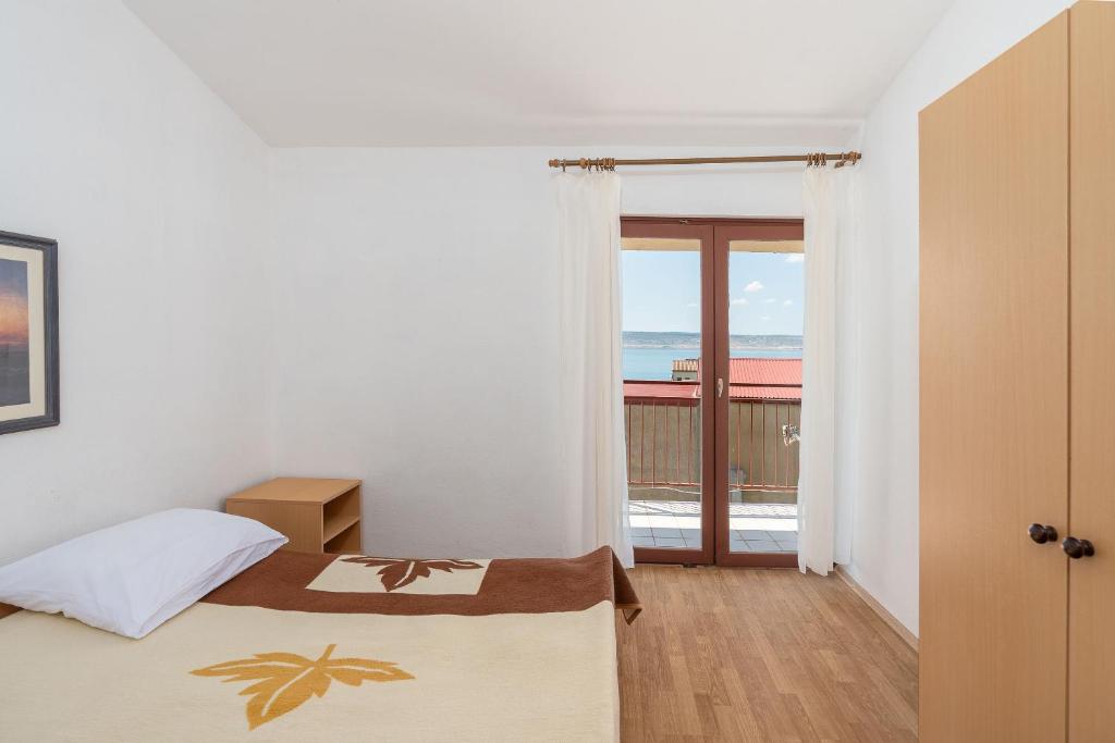 Postel nebo postele na pokoji v ubytování Apartment Sunny