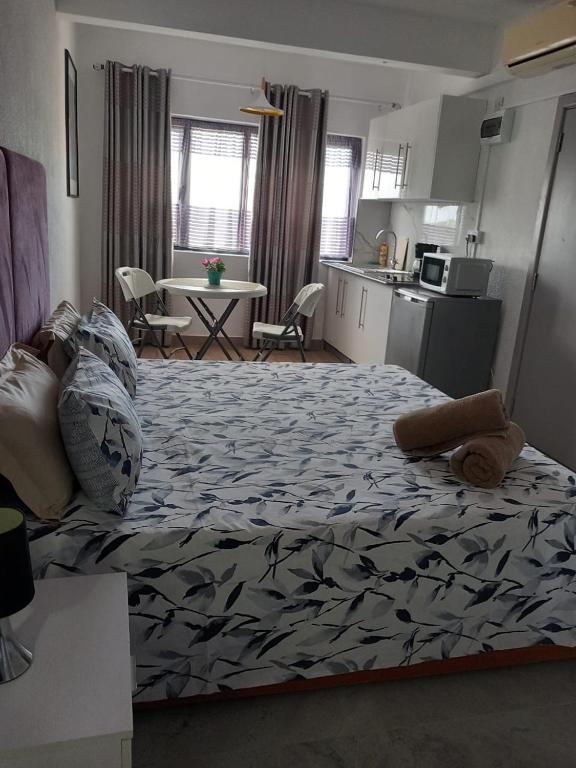 Postel nebo postele na pokoji v ubytování Ibis Tourist Residence 1