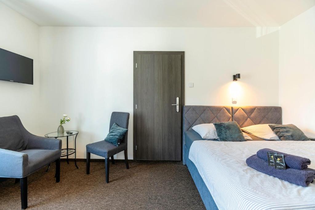 Postel nebo postele na pokoji v ubytování Restaurace Hotel Praha