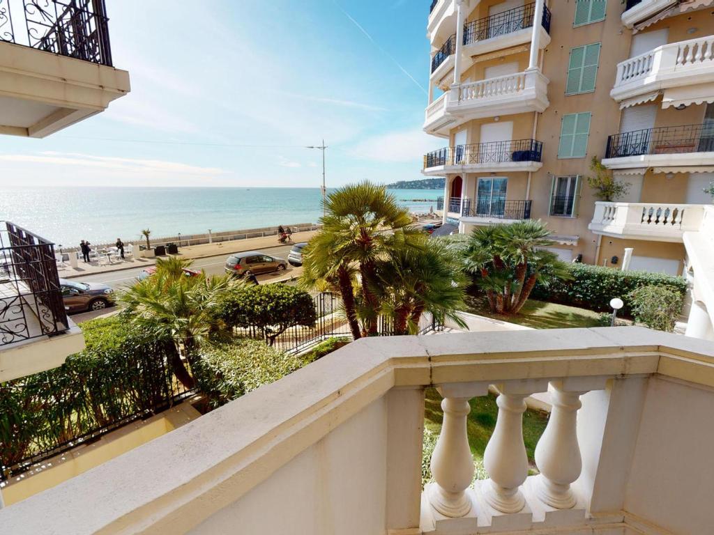 a view of the ocean from a balcony of a building at Superbe 2P centre Menton avec terrasse, clim, Wi-Fi - FR-1-196-152 in Menton