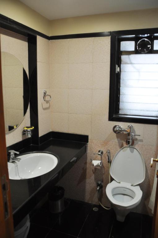 Koupelna v ubytování Hotel Abigail Regency