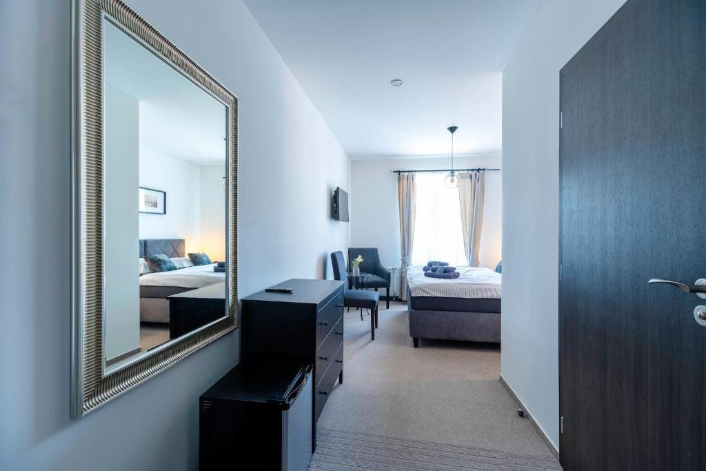 Postel nebo postele na pokoji v ubytování Restaurace Hotel Praha