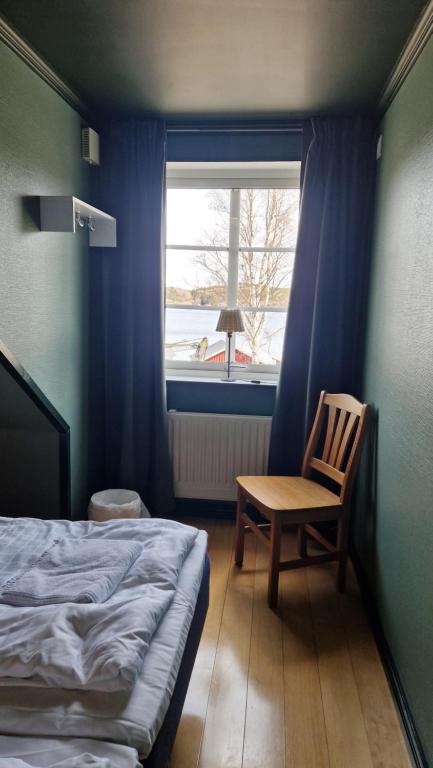 Postel nebo postele na pokoji v ubytování Skutskepparn Kuststation