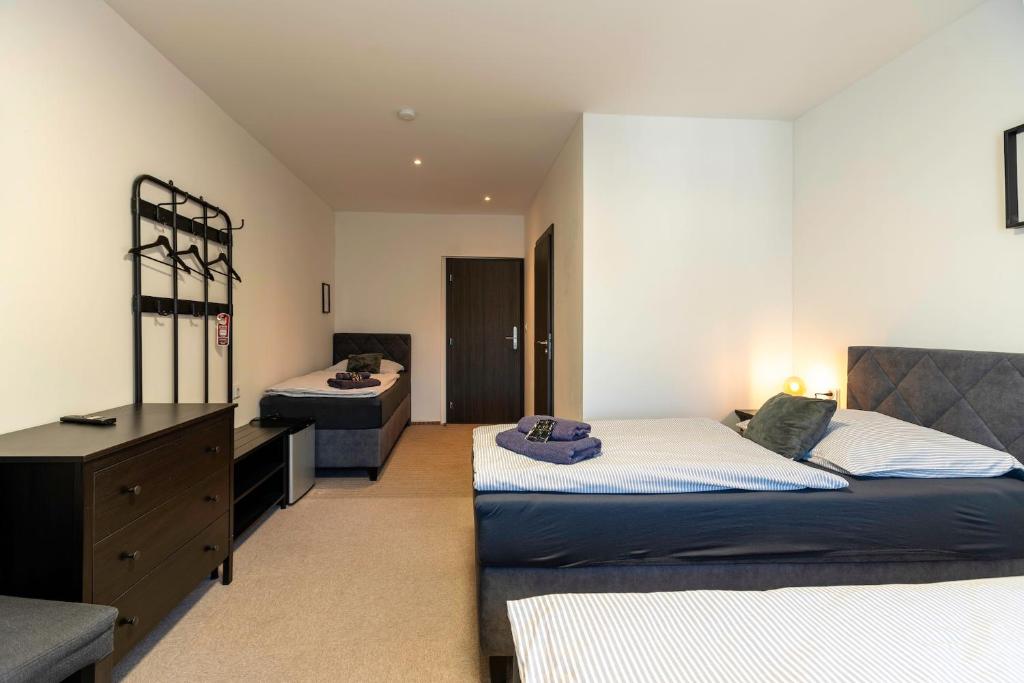 Postel nebo postele na pokoji v ubytování Restaurace Hotel Praha