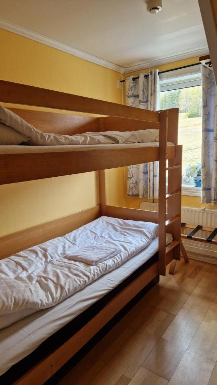 Postel nebo postele na pokoji v ubytování Skutskepparn Kuststation