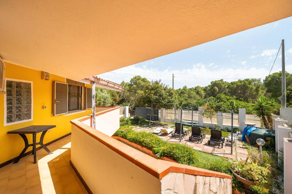 a view from the balcony of a house at Villa Mimosa in Porto Pino