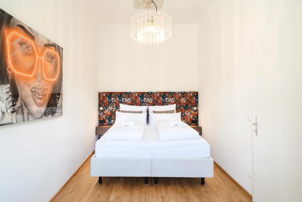 Ένα ή περισσότερα κρεβάτια σε δωμάτιο στο GH Luxury Apartments Graz, Gösser Haus