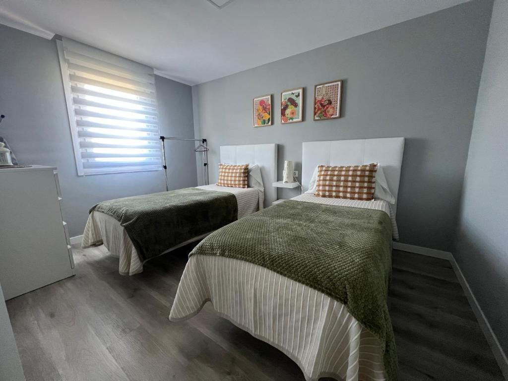 Postel nebo postele na pokoji v ubytování Apartamento da Fraga