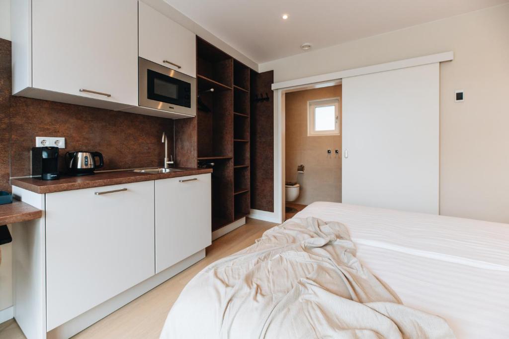 Kuchyň nebo kuchyňský kout v ubytování Hotel - B&B Renesse