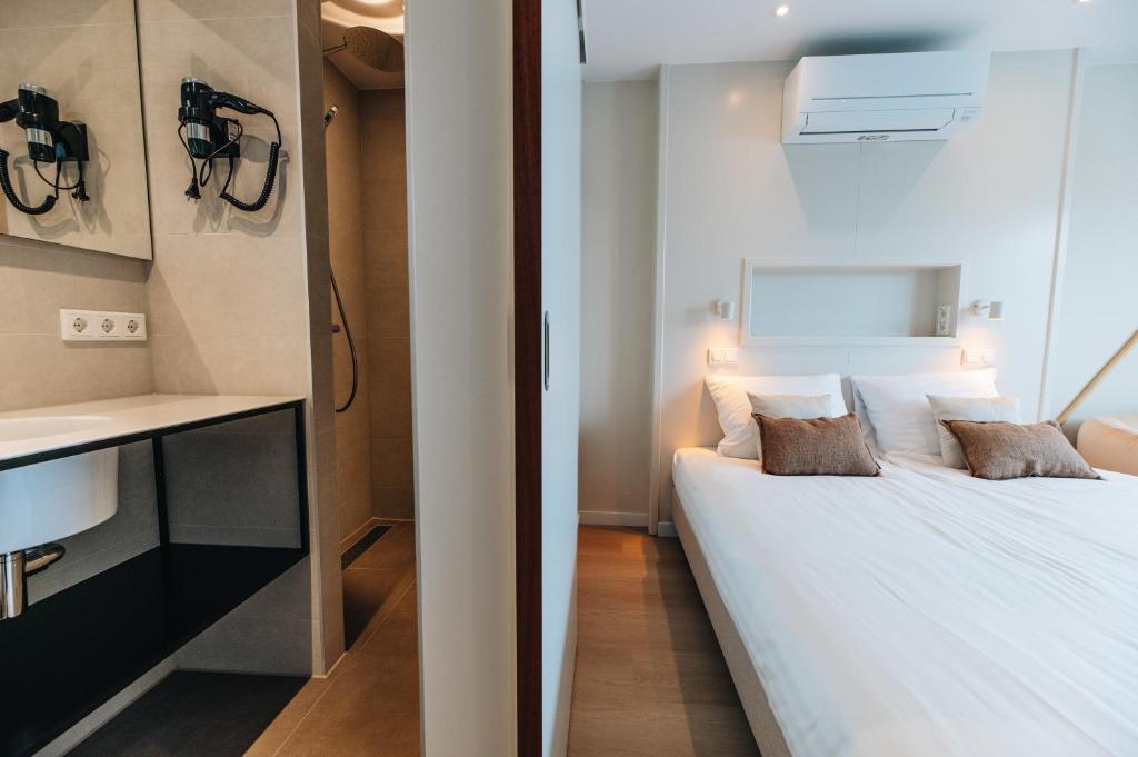 Postel nebo postele na pokoji v ubytování Hotel - B&B Renesse