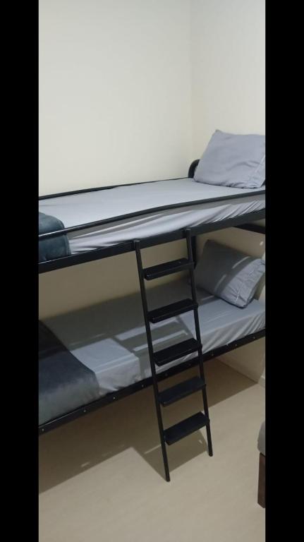 Postel nebo postele na pokoji v ubytování Hospedagem Apolinário