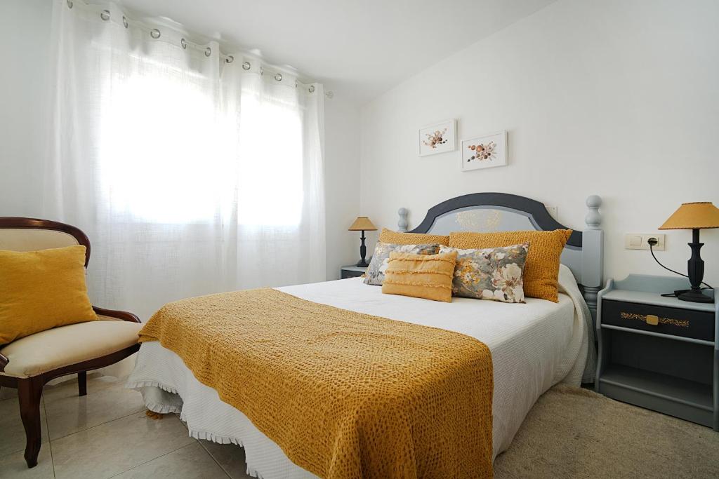 En eller flere senge i et værelse på Apartamento cerca del Paseo Marítimo de O Grove