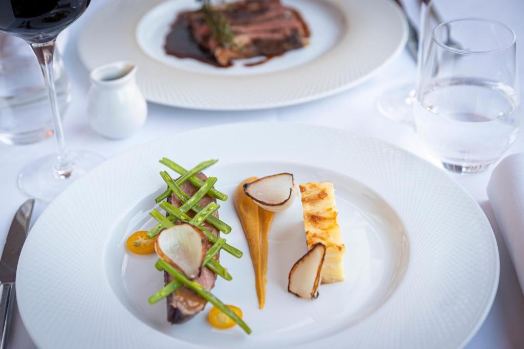 a white plate with food on a table at Glenroyal Hotel in Maynooth