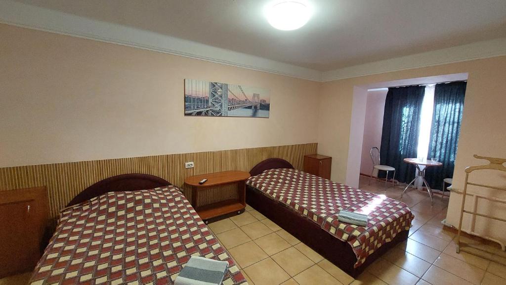 Postel nebo postele na pokoji v ubytování Hotel Desna KUT